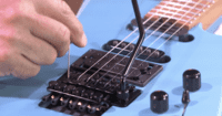 Justering af guitar med flydende bro